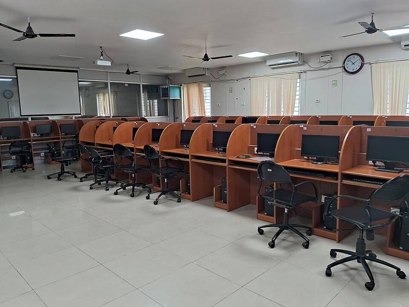 Rows of desktop computers in a training room