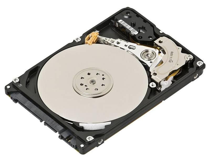 An exposed laptop hard drive showing the platter