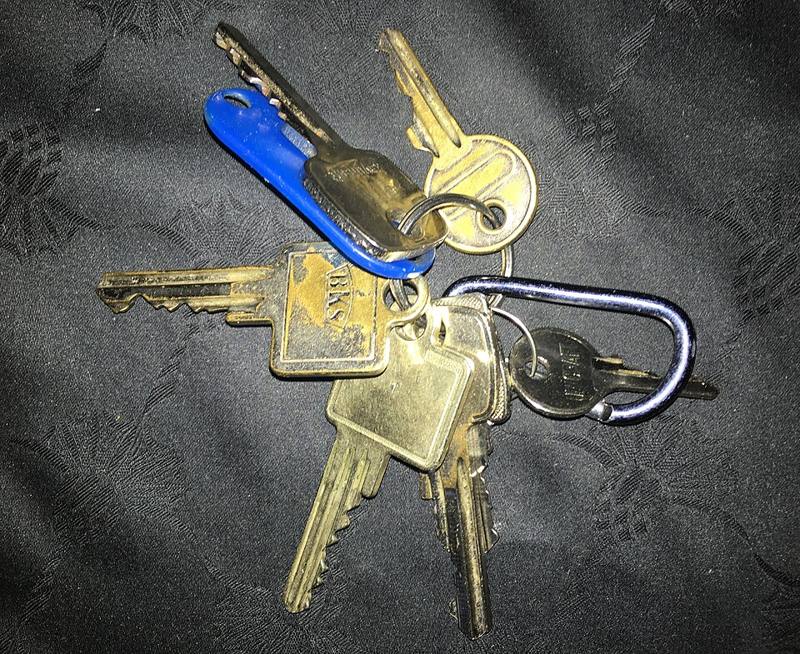 A bunch of metal keys on a ring